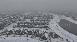 Drone footage shows Houston suburb covered in snow during winter storm