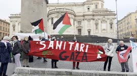 Israel-Hamas War: Protesters hold a banner reading ‘health doctors for Gaza’ as Palestinian flags are waved during the demonstration of solidarity with Dr. Hussam Abu Safiya of the health doctors for Gaza movement in Rome.
