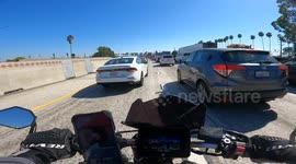 Lane Splitting Motorcyclist Hit By Sudden Merger