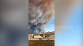 Massive plumes of smoke engulf town north of Los Angeles as Hughes Fire spreads