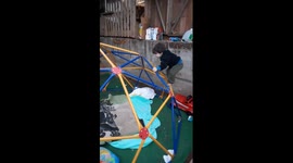 Adventurous toddler tries his hand on the playground climbing dome *Hilarious Fail*