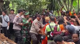 Landslide buries homes amid heavy rain in Indonesia