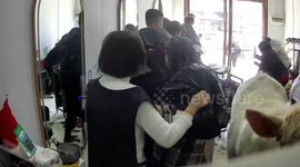 Customers startled as large cow barges into barbershop