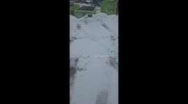 Truck Plate Frozen Into Snowbank