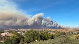 Hughes Fire sends thick grey smoking over homes in Santa Clarita, California