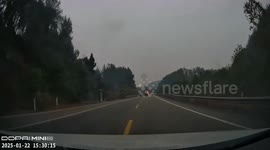 Passing drivers rescue motorist engulfed in flames from car crash in China