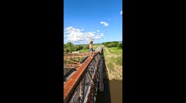 Triple flip off 25 meter bridge