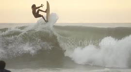 Extreme sports Surfing the waves at Canggu beach, Bali