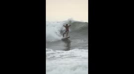 Extreme sport of surfing wave riders on Canggu beach, Bali