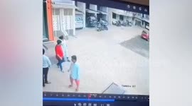 Residents sprints over to catch girl, 2, as she plummets from balcony