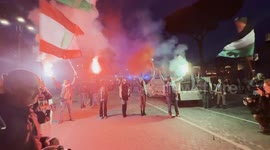 Israel-Hamas war: Protesters hold smoke bombs and wave Palestinian and Lebanese flags during the Palestine support rally ahead of Remembrance Day in Rome.
