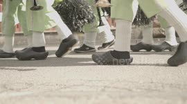 Close-up shoes at Carnival Parade on sunny day in Germany. Slow-Motion.