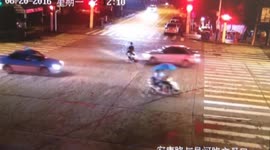 Scooter rider gets hit by car after running a red light