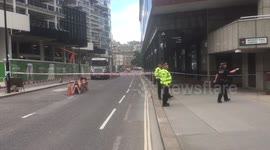 Police close London street due to suspicious package.