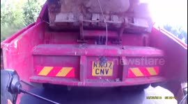 Cyclist uses rubbish lorry's slipstream to build up incredible speed