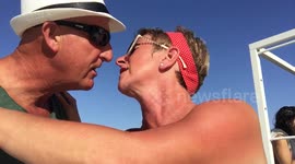 Recently engaged couple film heartwarming kiss video for social media