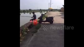 Motorcycle starts by itself and pushes fisherman into water