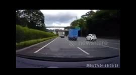 Audi hits Mazda after it leaps over central reservation