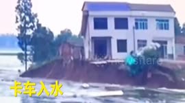 Lorry loading granites drives into floodwater to stop dam collapsing
