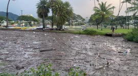 Filthy River of trash in Waikiki hawaii | after heavy rain the Ala Wai Canal is full of trash. matresses, pillows, emtpy canisters, plastic bags…  not far from there pepppe pay $400 per night to stay at a hotel and lay at beautiful Waikiki beach