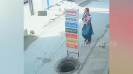 Mother and baby fall into uncovered manhole in India