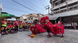 Locals in Thailand mark Chinese New Year with a red lion dance