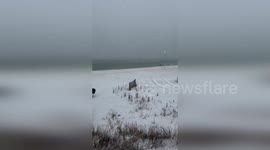 US: Snow Covers Orange Beach in a Historic Winter Surprise