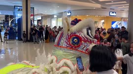 Barongsai attractions performed in a Mall in Makassar City, Indonesia ahead of the Chinese New Year celebration
