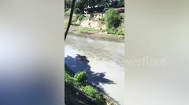 Warehouse oil spill flows into canal threatening largest lake in the Philippines