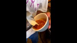 Barista creates artistic coffee masterpiece for customer at UK coffee shop