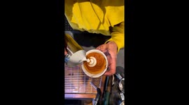 Barista crafts stunning seahorse artwork on customer's coffee
