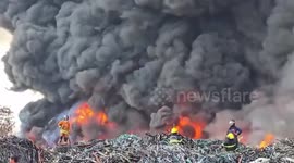 Thick smoke rises from fire engulfing plastic waste in Thailand