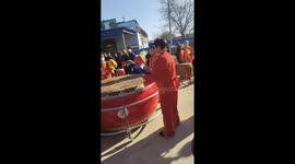 Locals hold traditional Chinese drumming performance in village