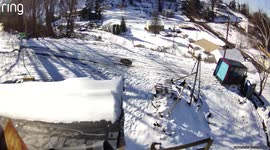 Shocking moment Amazon van slides downhill on icy road and crashes into a church