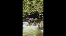 Hiker slips into river while trying to cross waterfall