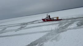 Ice breakers rescue stranded vessel on frozen Lake Erie in New York