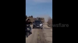 Lebanon: An Israeli Merkava tank pursues Lebanese civilians in a vehicle and on a motorcycle in the village of Marwahin, southern Lebanon