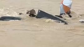 Residents scramble to save possessions in neck-deep Malaysia floods