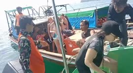 Backpackers rescued from sinking speedboat in rough Thai seas
