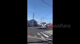 Japan: Rescuers Race To Pull Out Truck Driver Stuck In Sinkhole