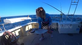 'My catch threw up!' - Tuna fish spews out bait fish after getting caught