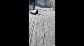 Snowboarder On Tow Lift Fails To Mind Pole