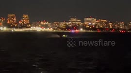 Emergency services search river after helicopter hits plane landing