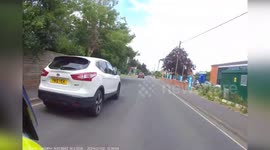Couple on e-bike fleeing police motorbike rider crash into wall