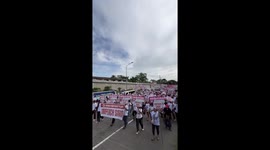 Protesters march into street calling for impeachment of Vice President Duterte