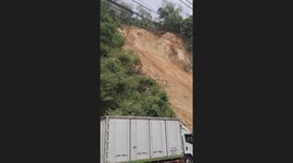 Landslide tumbles down hillside blocking road below in Thailand