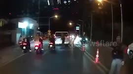 Tourists speed though police checkpoint to avoid being fined