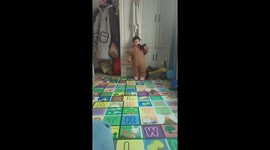 Baby imitates movie scene with toy gun in Yunnan