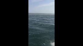 Man seen standing in the middle of the sea in Mussulo, Angola