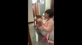 Child decorates dog with hair and shoes in Jiangsu, China